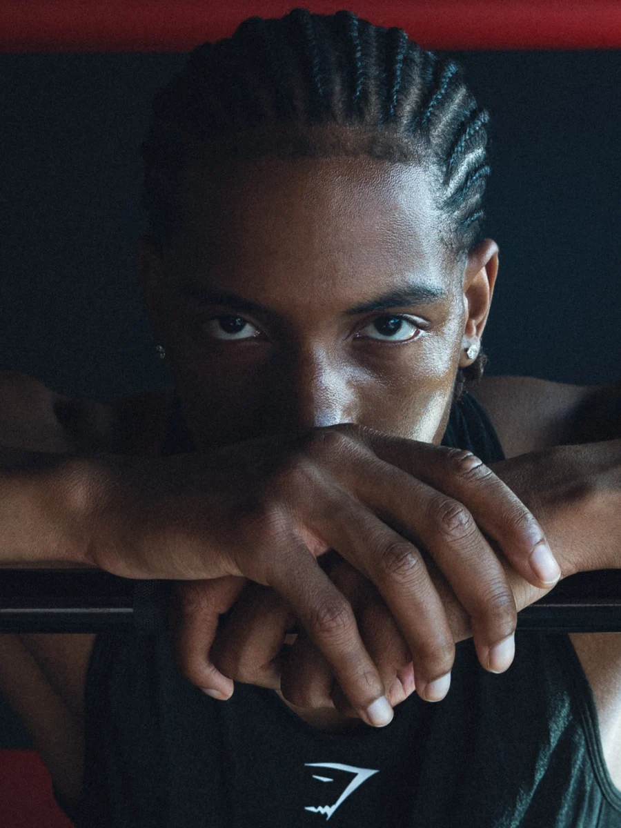 An intense portrait gripping a barbell
